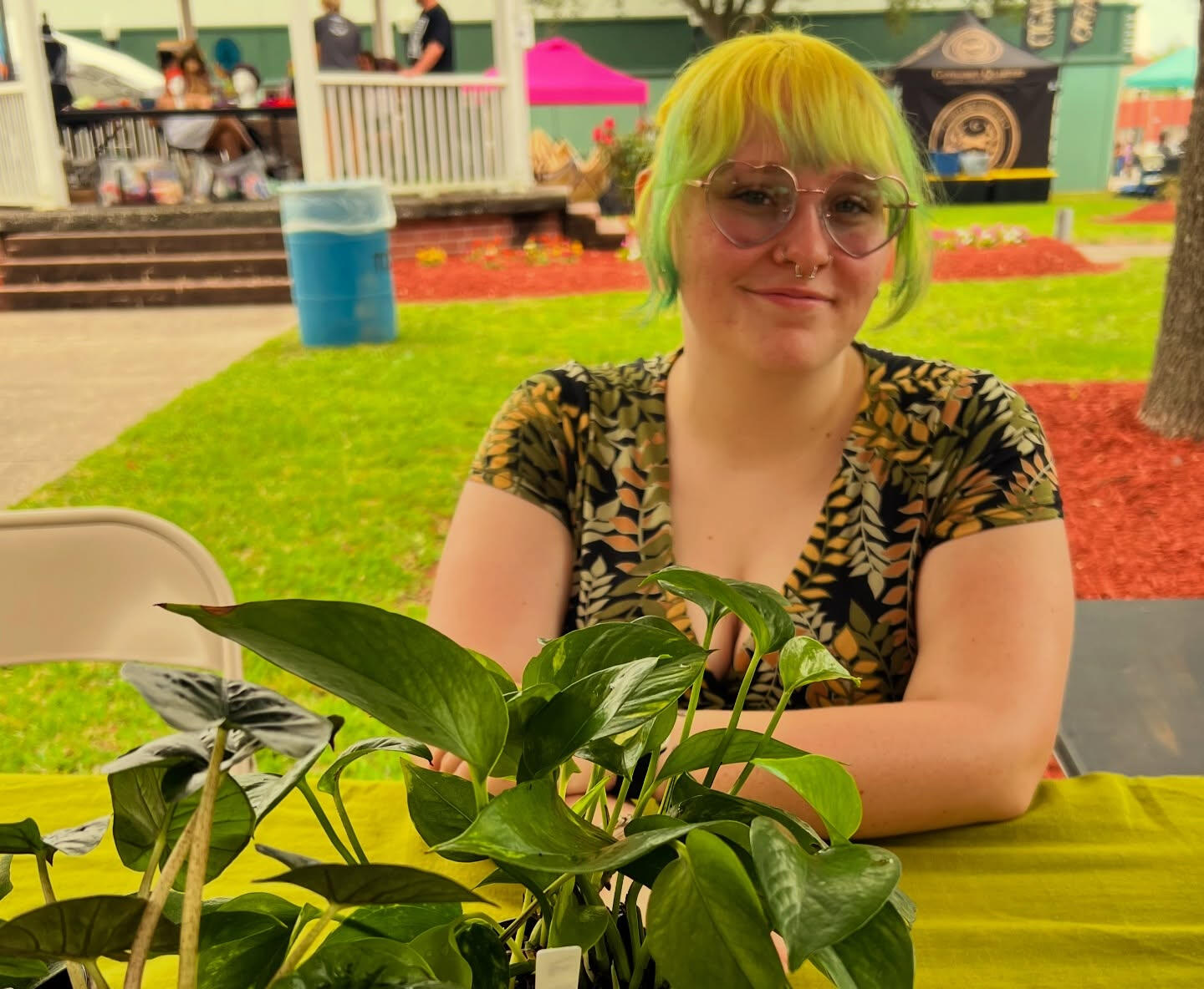 Leaf Love Studio Anaya, a young woman smiling at a table with plants
